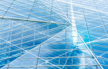 sustainable glass building and wind power concept